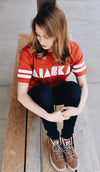 Alaska t-shirt in red and white football style tee. 